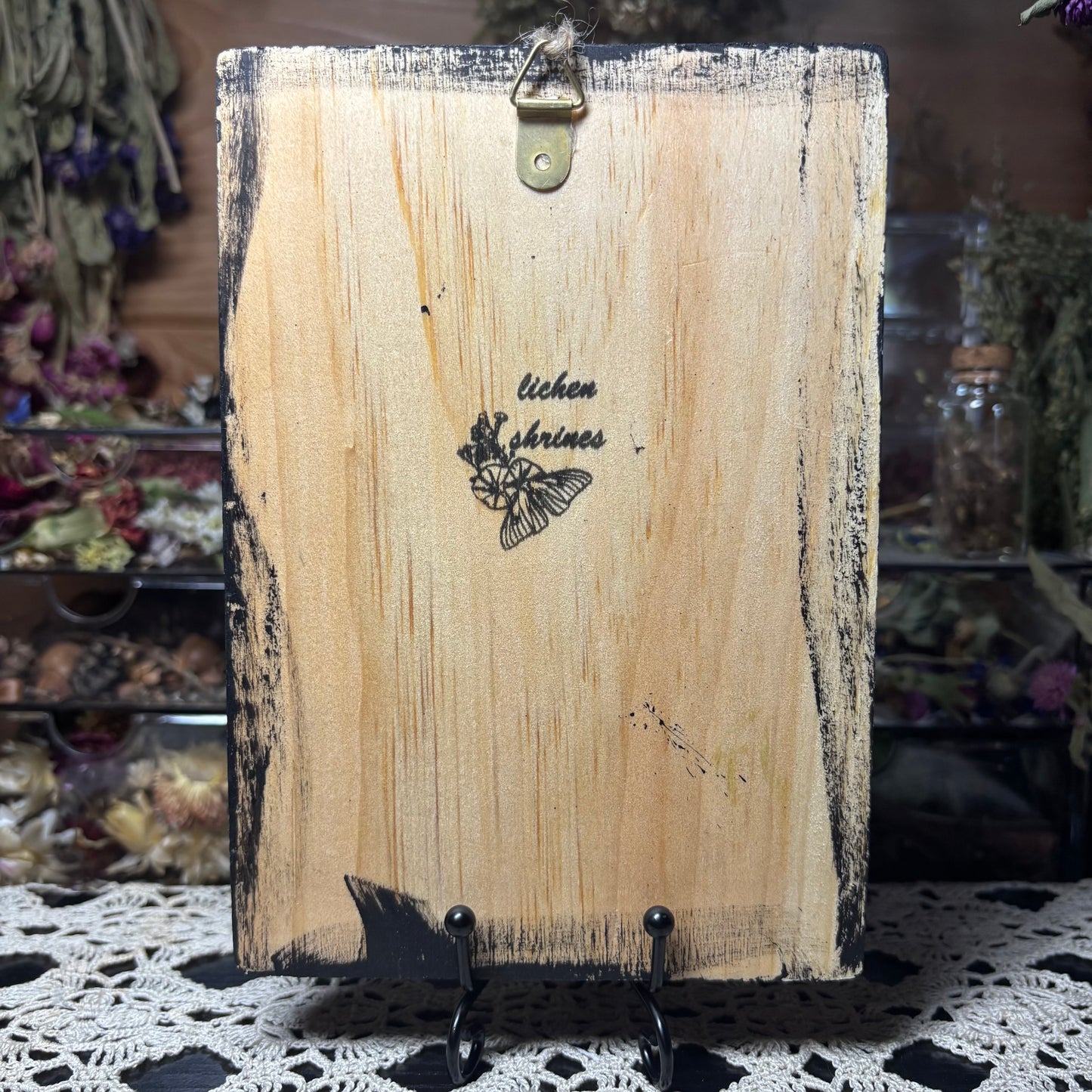 raccoon feet wood plaque